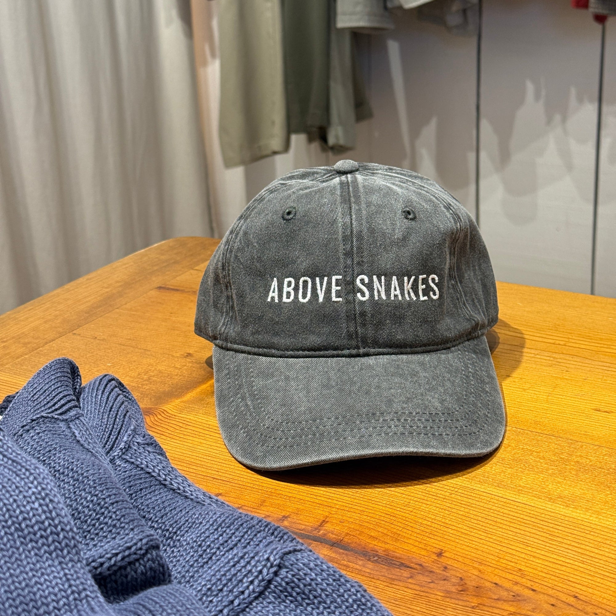 ABOVE SNAKES Hat
