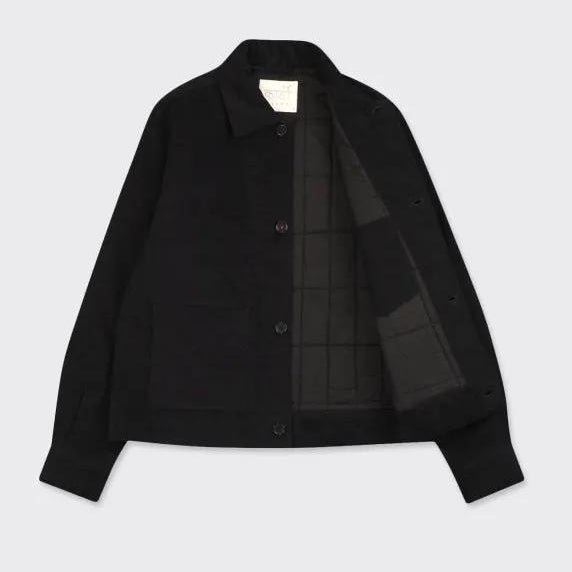 Kardo Bodhi Jacket in black, water-resistant outer layer with plaid-lined interior for daily wear.