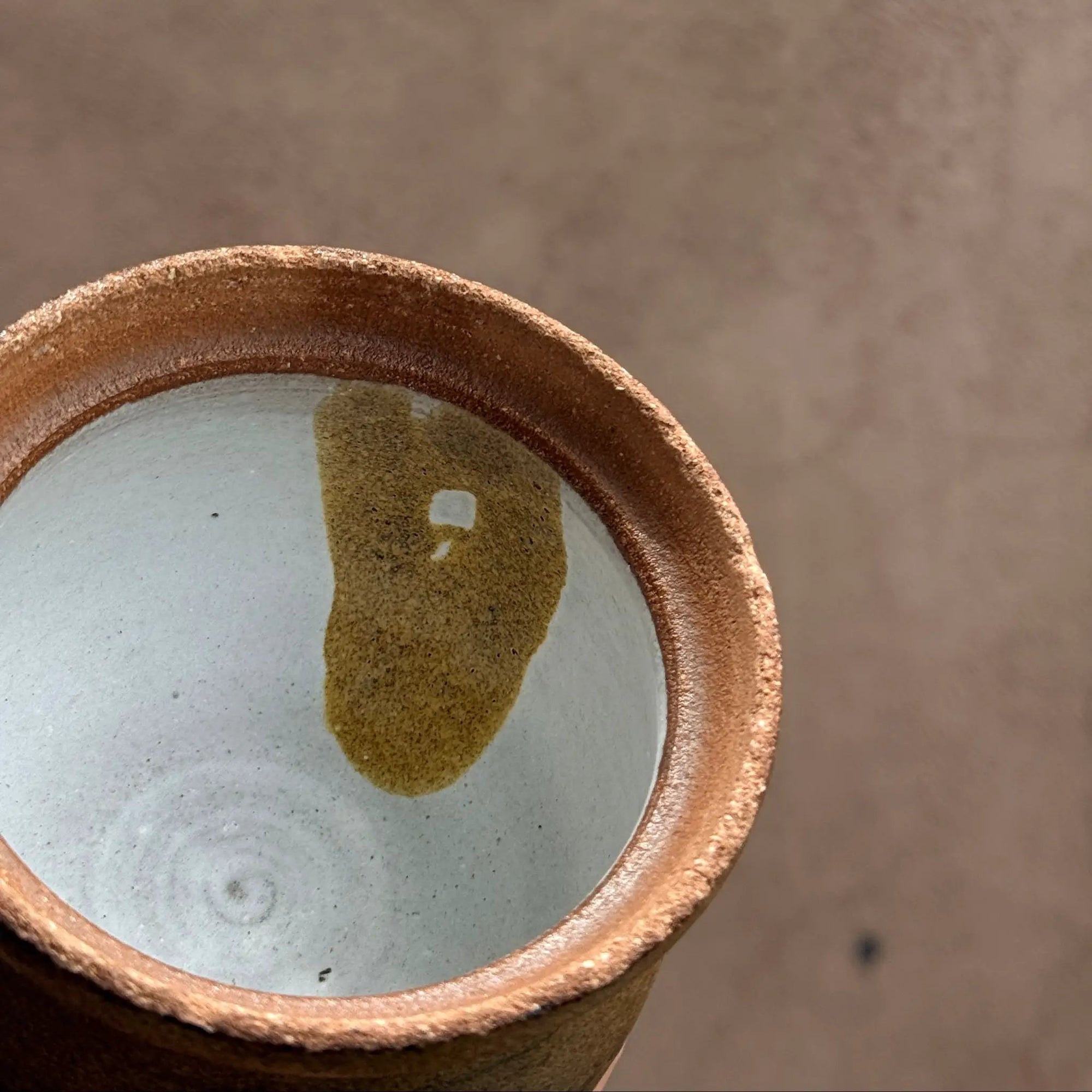 PL Small Brown Ceramic Bowl with White Interior by Above Snakes