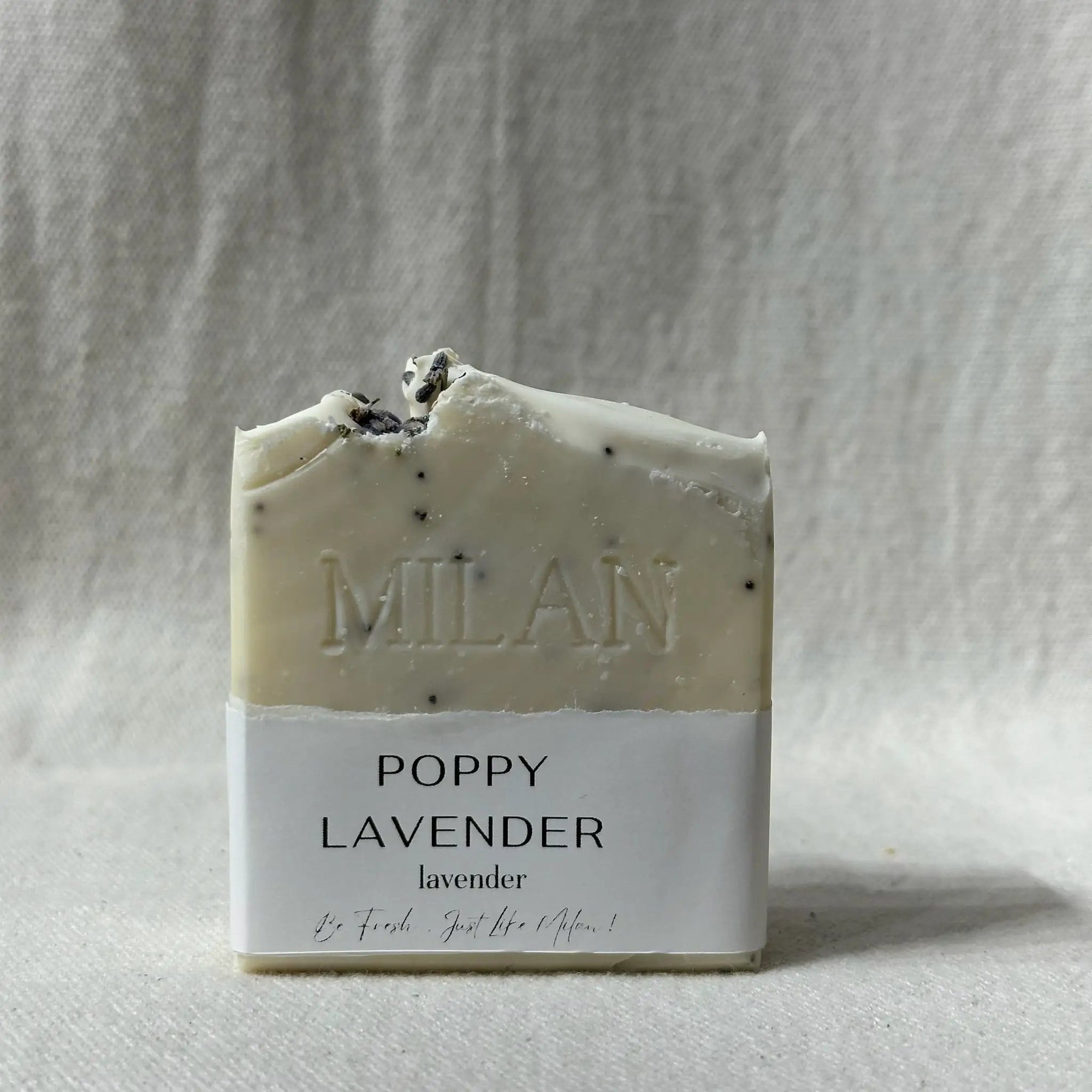 Milan Soaps Poppy Lavender soap bar with lavender buds on a light background